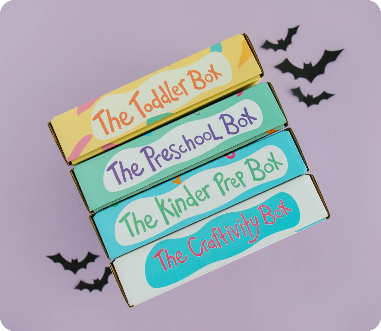 The Toddler, Preschool, Kinder Prep and Craftivity boxes stacked with paper bats