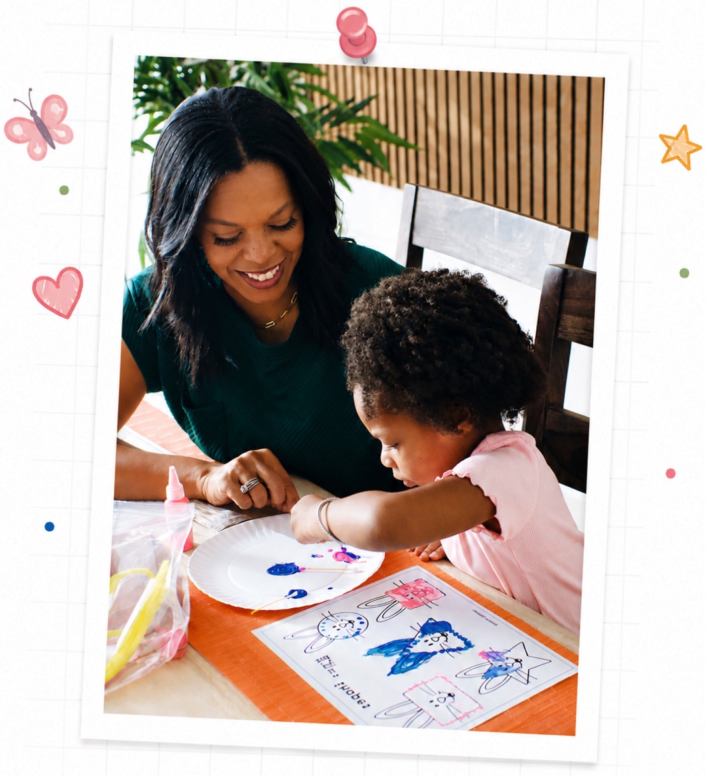 A mother and daughter painting together at the kitchen table